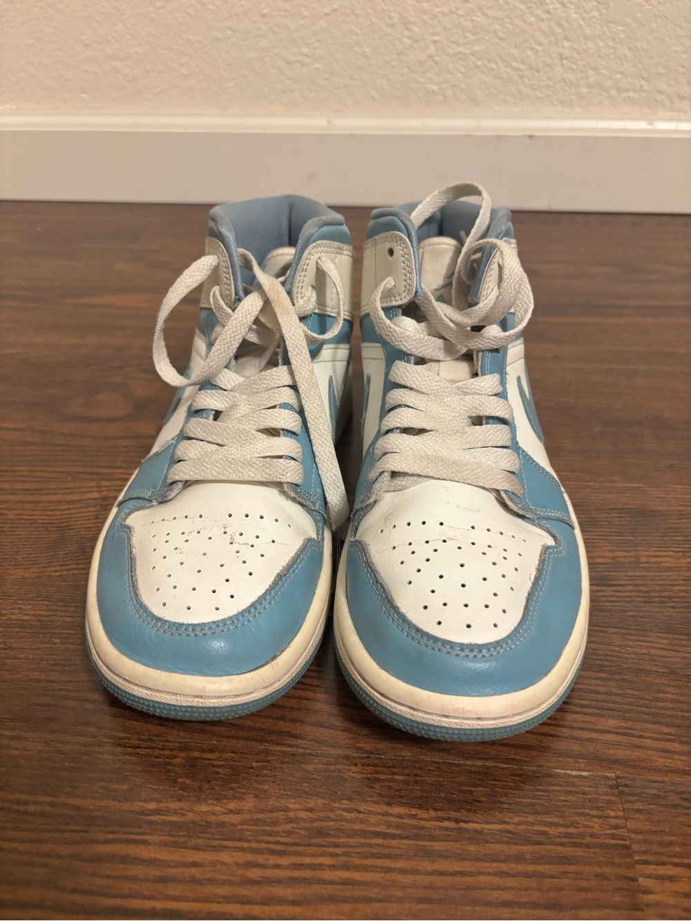 Jordan women’s High-Top Sneakers in White and Light Blue